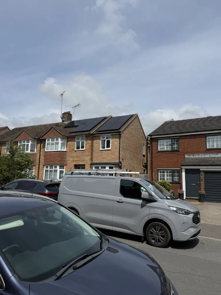 Semi-detached house with solar panels and the SF Mann van parked outside